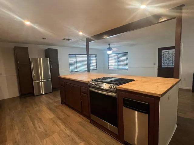 a room that has a window and wooden floor