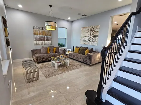 a living room with furniture fireplace and rug