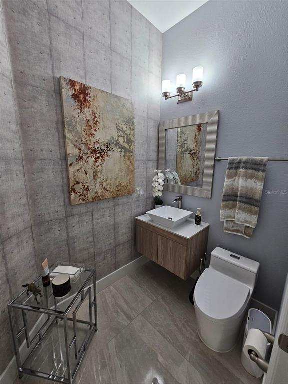 8552 Powder Ridge Trail Windermere, FL 34786 - Photo 17 of 30 a bathroom with a toilet sink and mirror