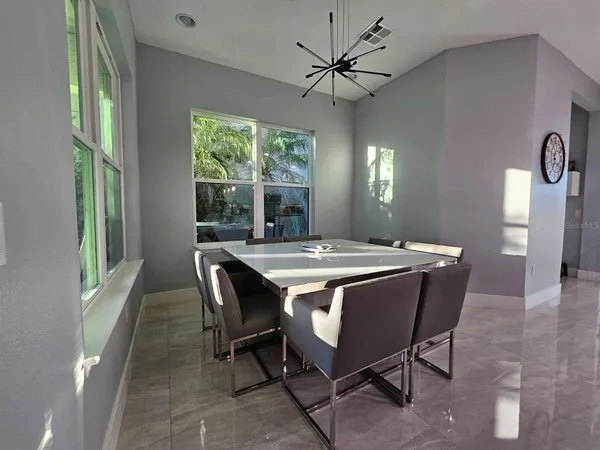 a view of a dining room with furniture window and outside view