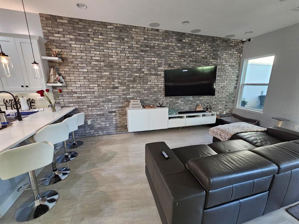 8552 Powder Ridge Trail Windermere, FL 34786 - Photo 20 of 30 a living room with furniture and a flat screen tv