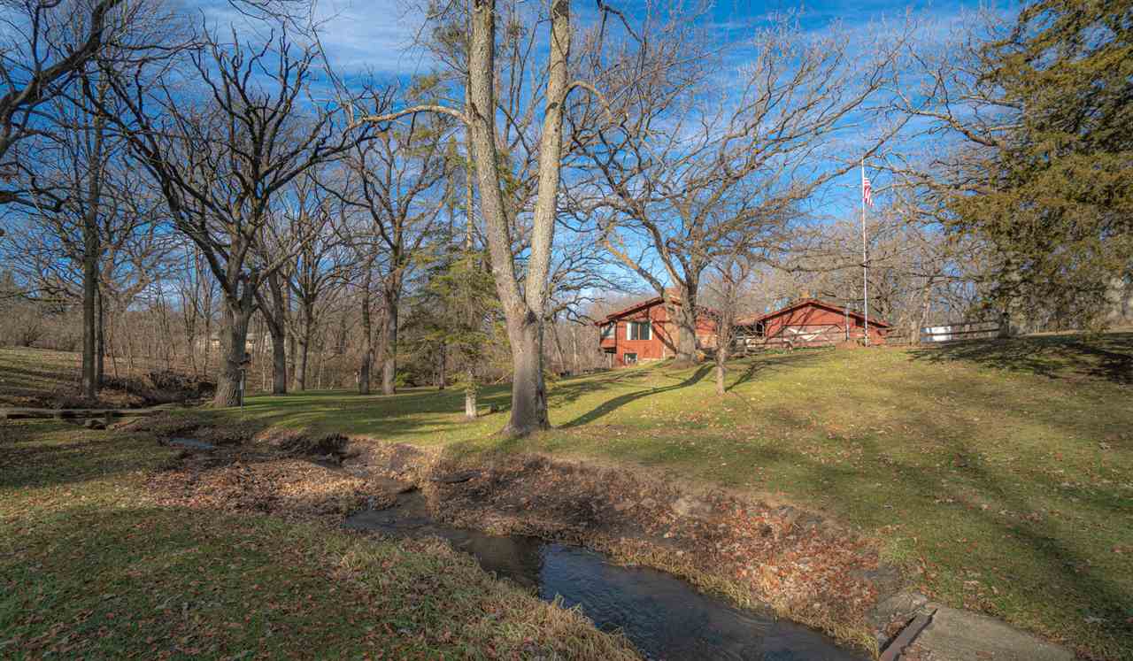 5760 Rotary Road Cherry Valley, IL 61016 - Photo 1 of 25 a view of yard with tree