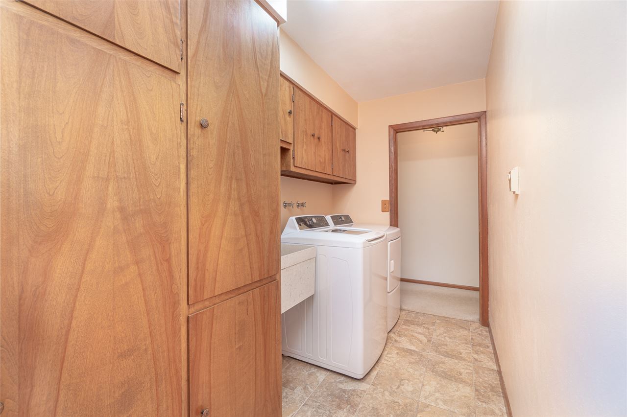 5760 Rotary Road Cherry Valley, IL 61016 - Photo 11 of 25 a utility room with cabinets washer and dryer