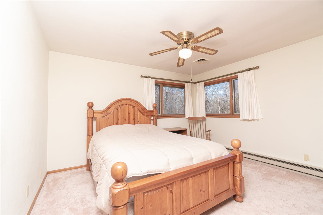 5760 Rotary Road Cherry Valley, IL 61016 - Photo 12 of 25 a bedroom with a bed and window