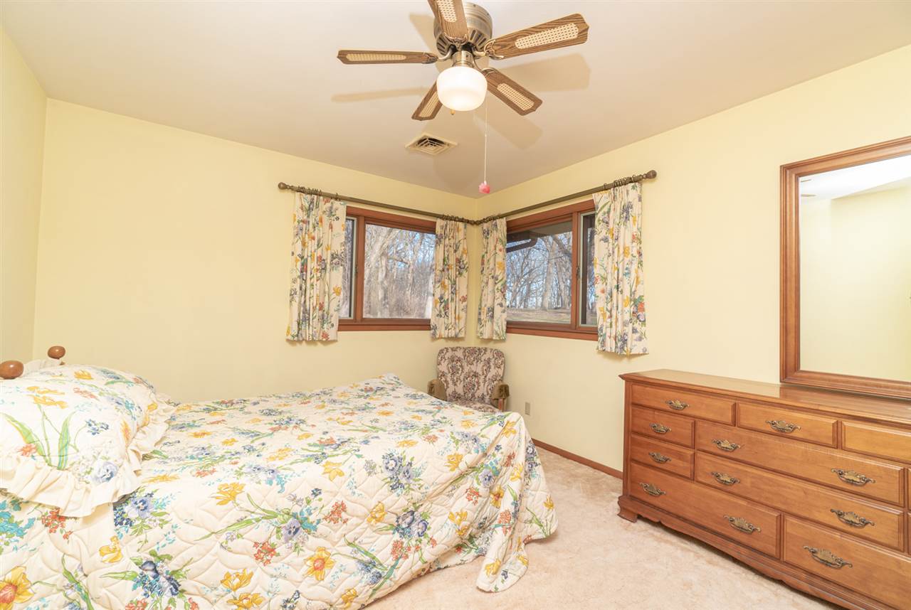 5760 Rotary Road Cherry Valley, IL 61016 - Photo 13 of 25 a bedroom with a bed and a window