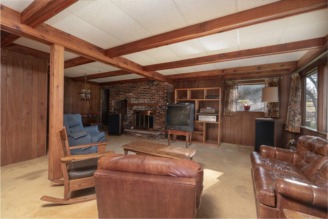 5760 Rotary Road Cherry Valley, IL 61016 - Photo 17 of 25 a living room with furniture and a fireplace