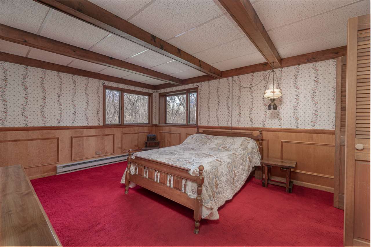 5760 Rotary Road Cherry Valley, IL 61016 - Photo 20 of 25 a bedroom with a bed and a window