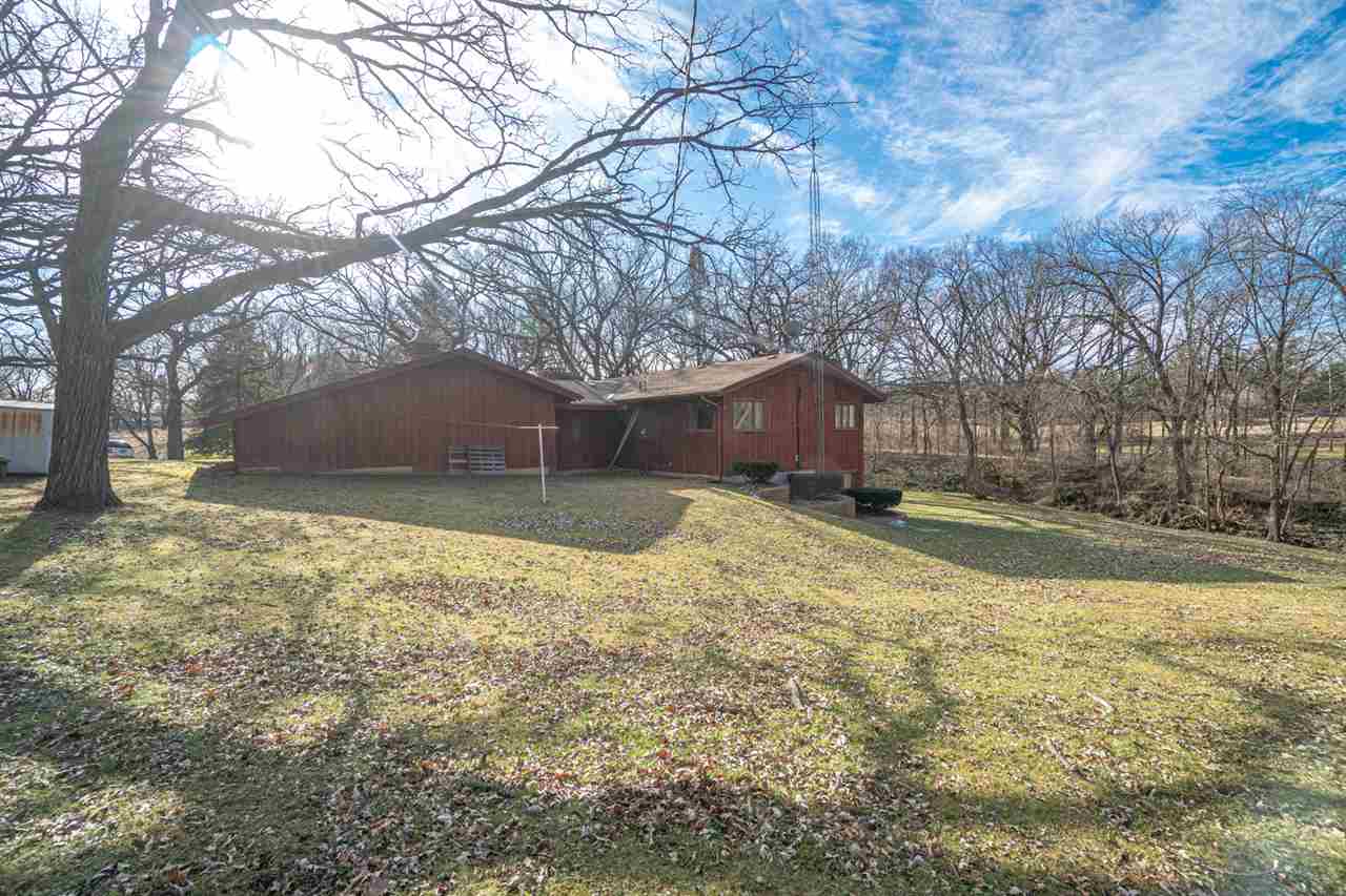5760 Rotary Road Cherry Valley, IL 61016 - Photo 24 of 25 a view of a house with a yard covered with snow