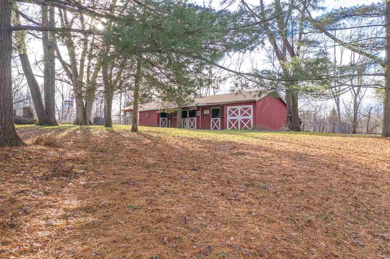 5760 Rotary Road Cherry Valley, IL 61016 - Photo 4 of 25 a view of a yard with a house