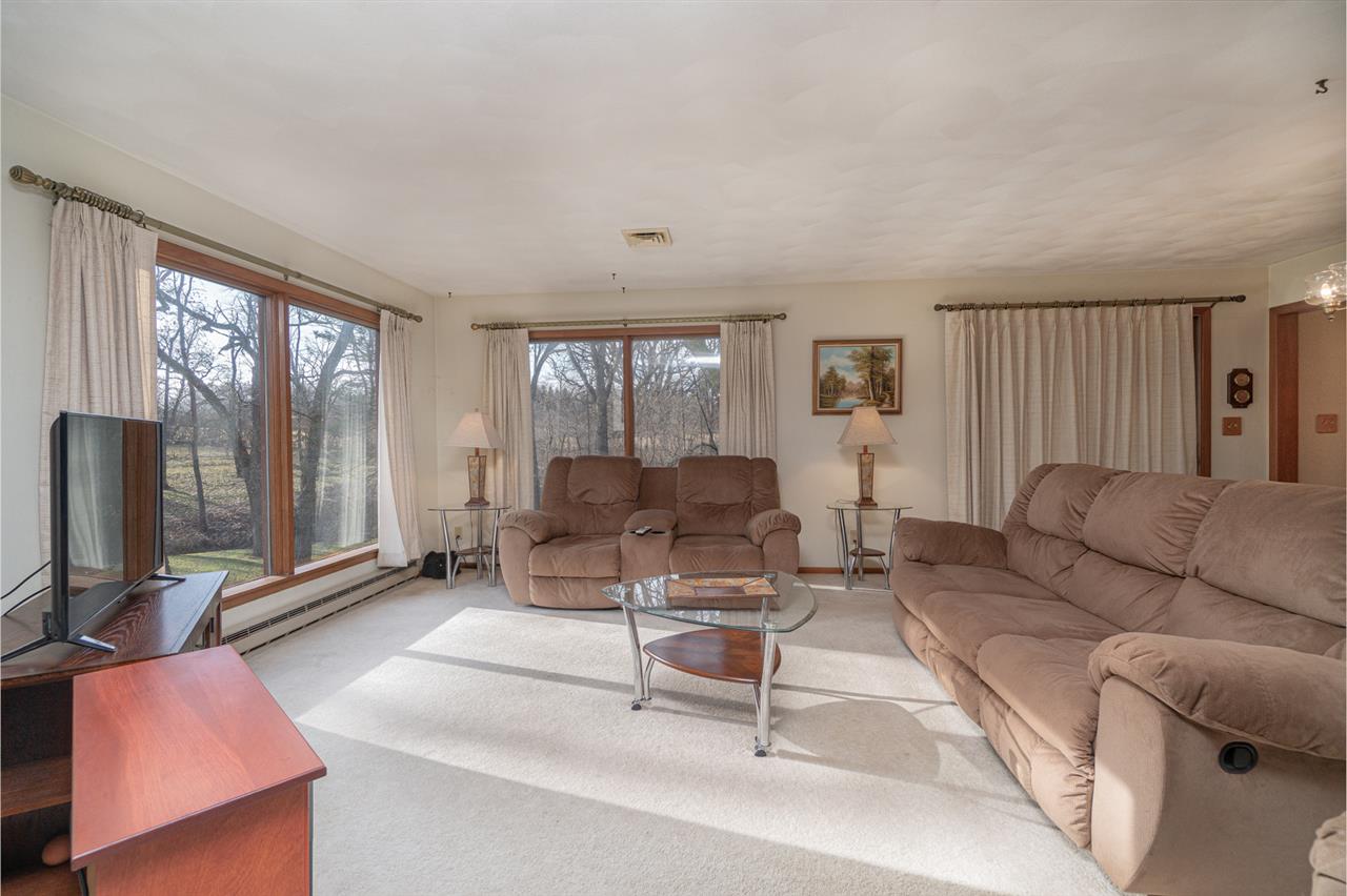 5760 Rotary Road Cherry Valley, IL 61016 - Photo 6 of 25 a living room with furniture and a flat screen tv