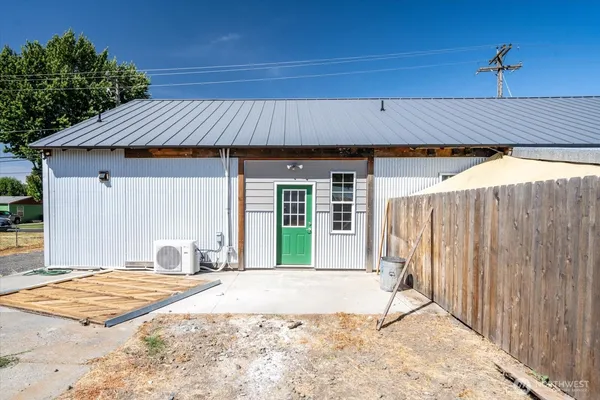 a front view of a house with a outdoor space