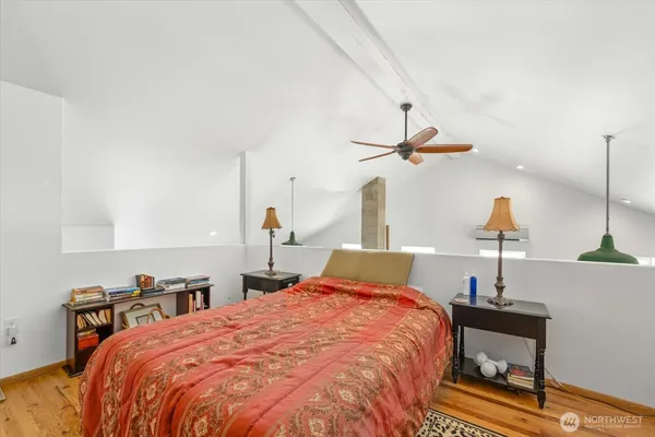 a bedroom with bed and window