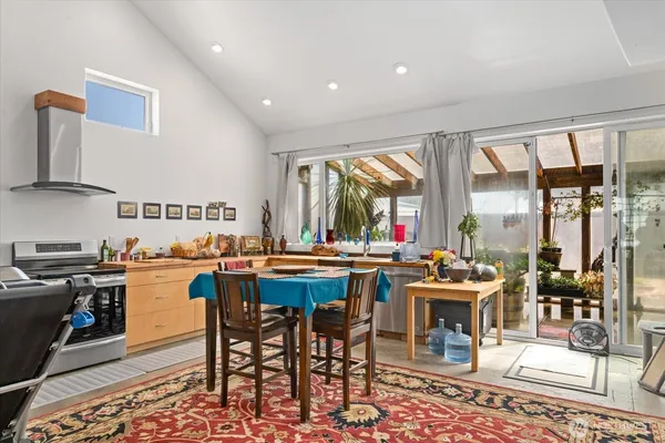 a view of a dining room with furniture window and outside view