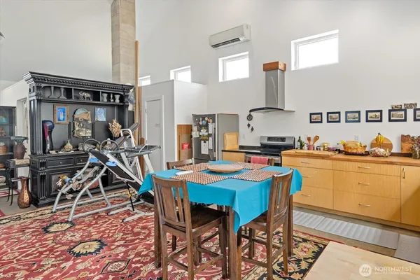 a kitchen that has a table and chairs in it
