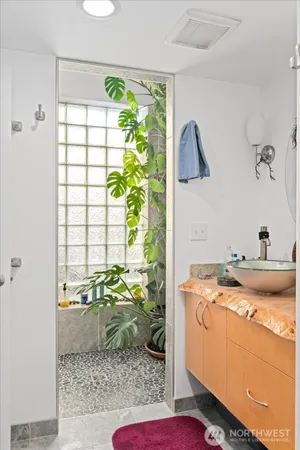 a view of bathroom with a tub shower and sink