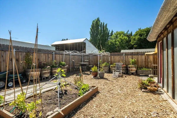 a view of a patio with chairs and tables