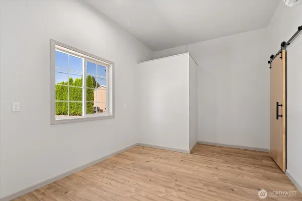 a view of a room that has a window in it
