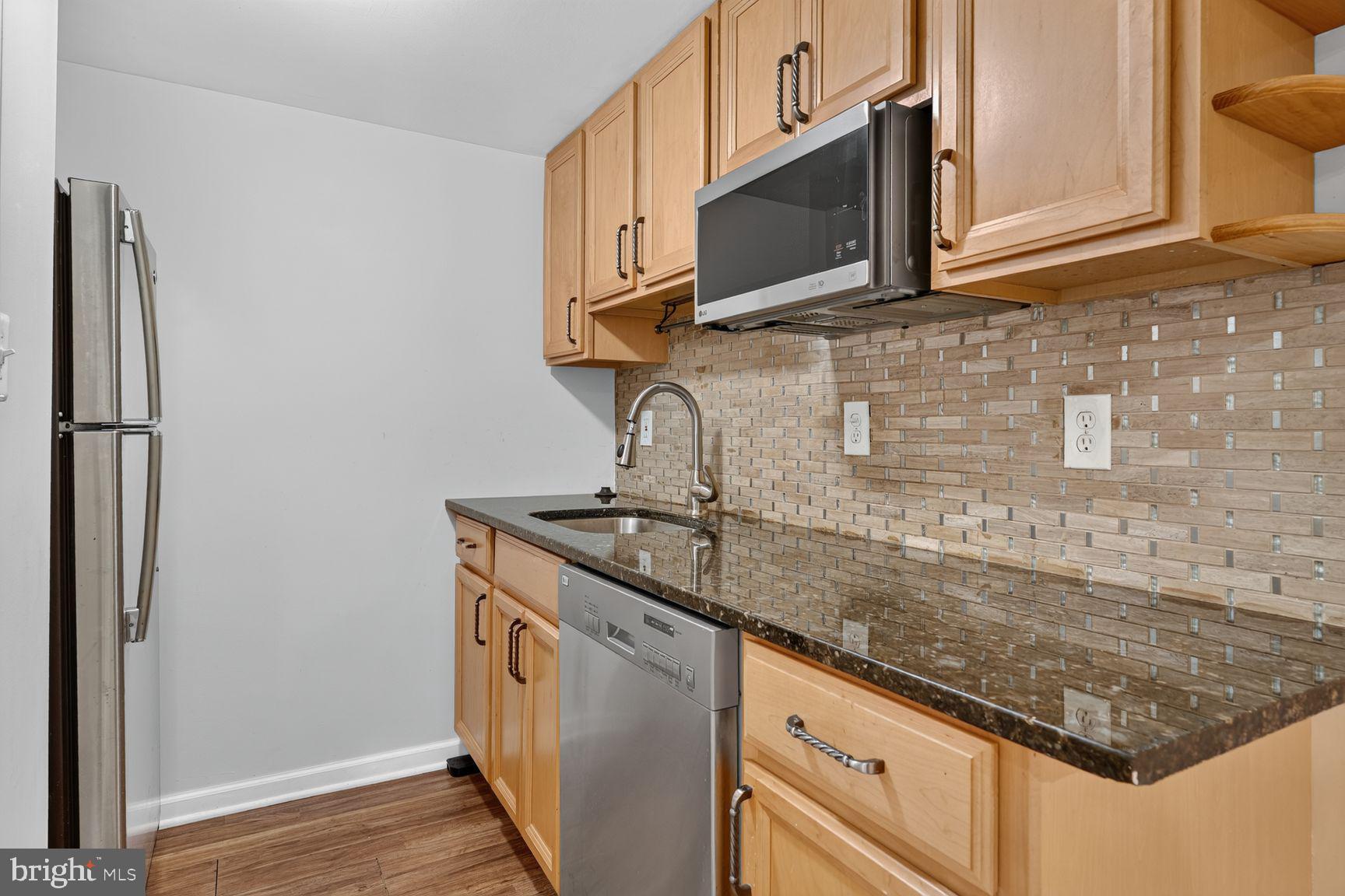 6223 Rathlin Drive Springfield, VA 22152 - Photo 23 of 27 KItchen in LL includes refrigerator and microwave