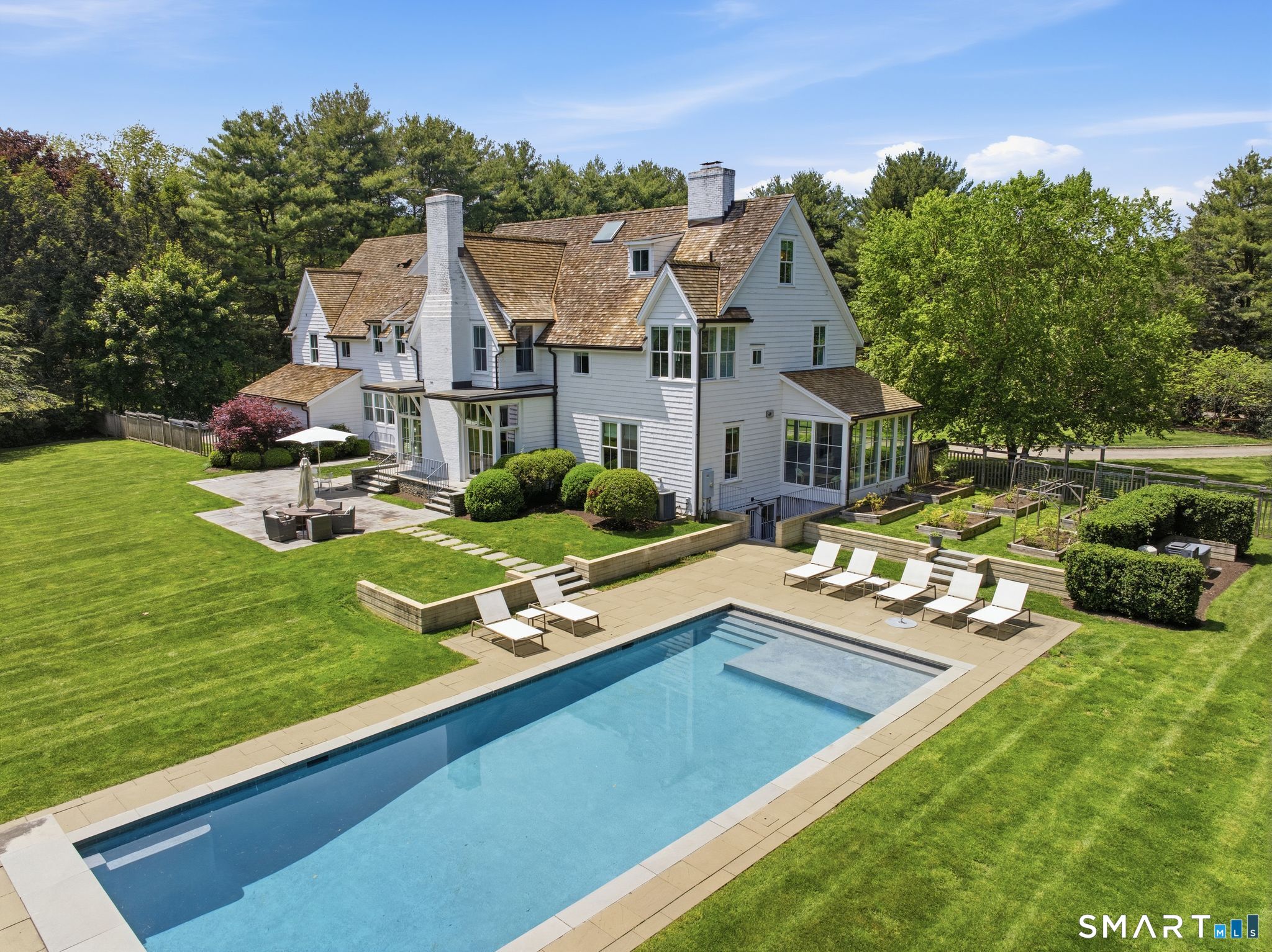 5 West Branch Road Weston, CT 06883 - Photo 6 of 40 an aerial view of a house with swimming pool garden and patio