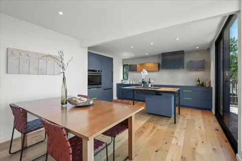 a kitchen with stainless steel appliances granite countertop a sink and a microwave
