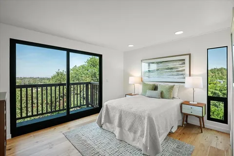 a view of a room with mirror and a window