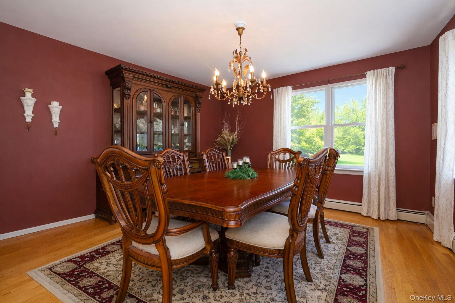 9 Mt Ridge Court Monroe, NY 10950 - Photo 18 of 49 a view of a dining room with furniture and chandelier