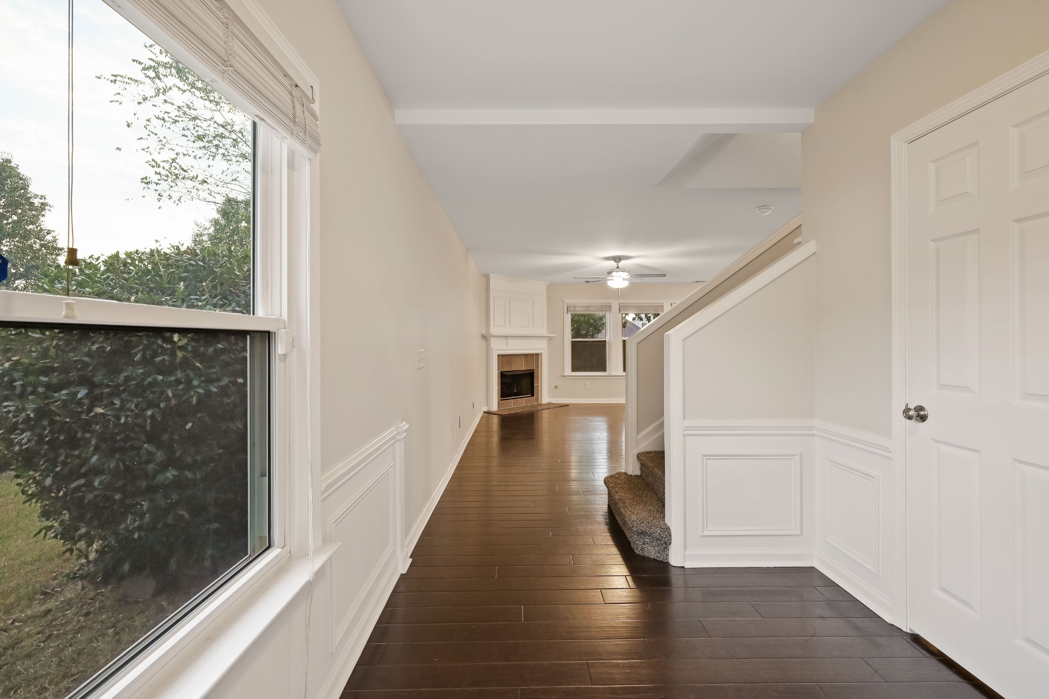 2201 Cardiff Lane Mount Juliet, TN 37122 - Photo 14 of 47 a view of a hallway with wooden floor staircase and a living room