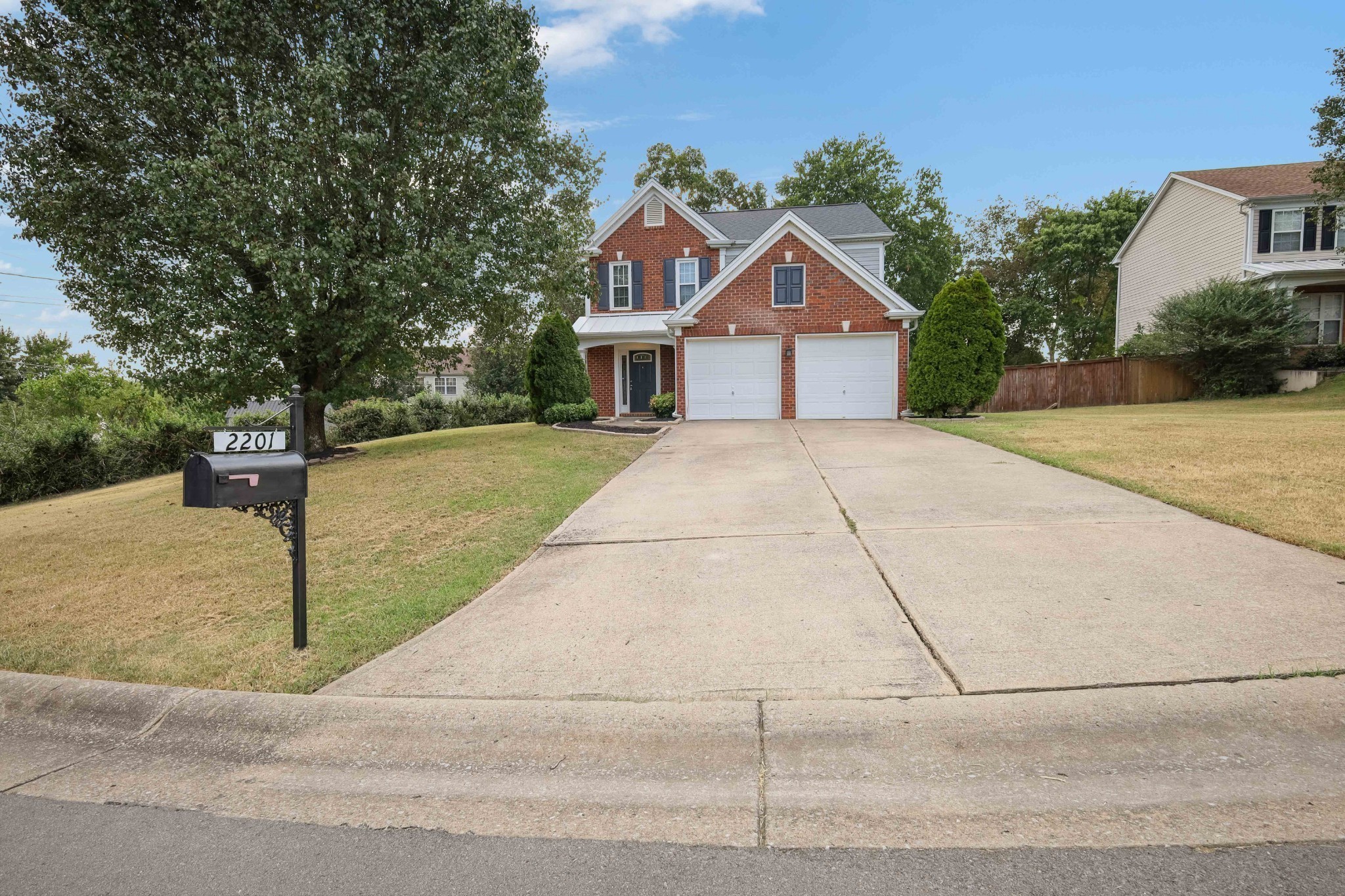 2201 Cardiff Lane Mount Juliet, TN 37122 - Photo 3 of 47 a front view of a house with a yard and garage