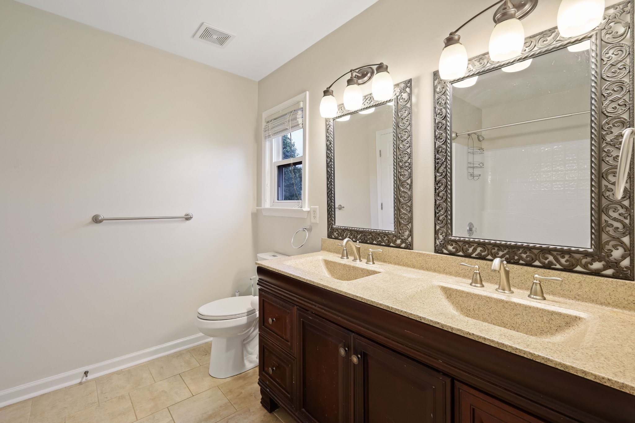 2201 Cardiff Lane Mount Juliet, TN 37122 - Photo 31 of 47 a bathroom with a double vanity sink toilet and mirror