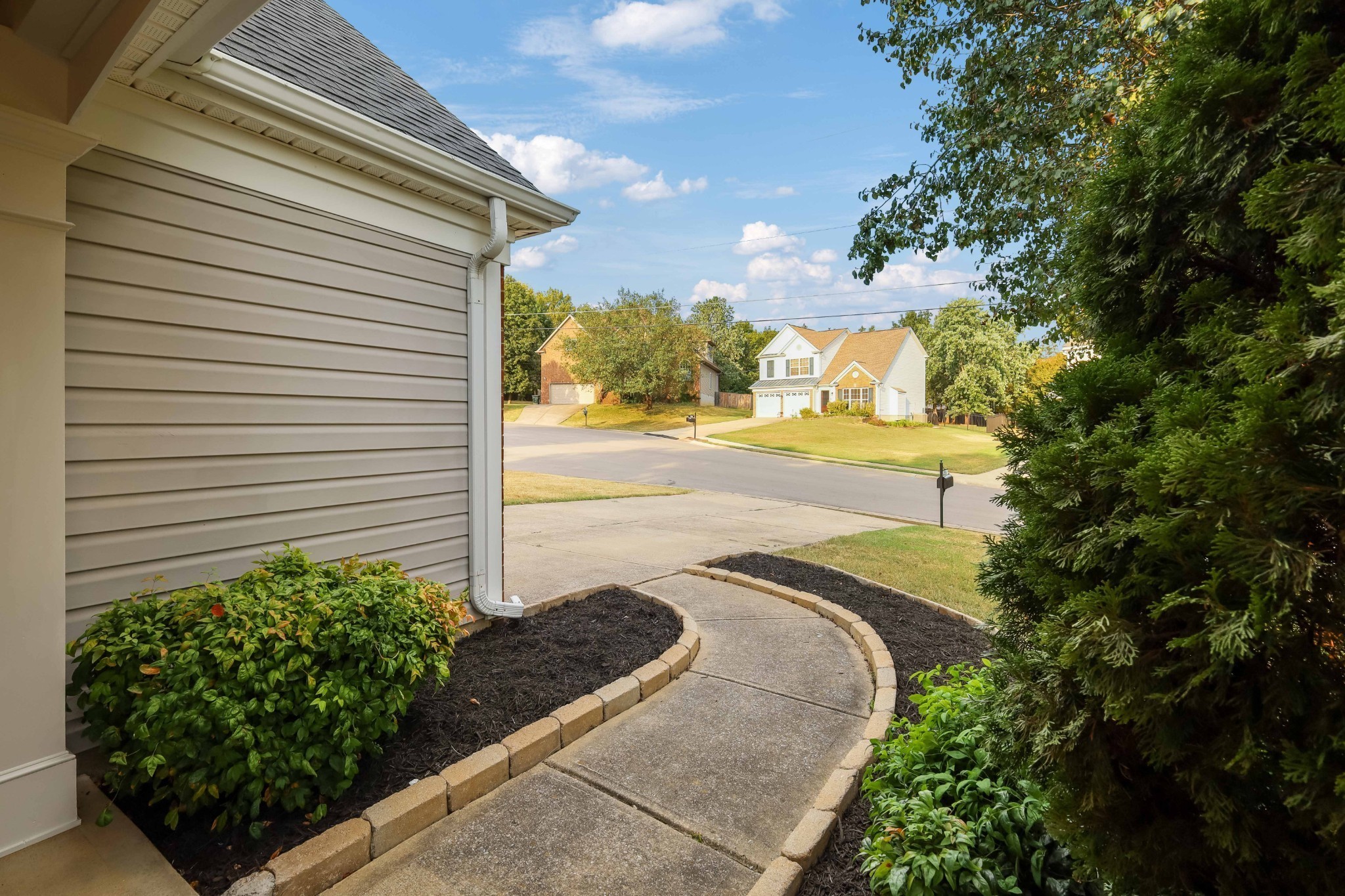 2201 Cardiff Lane Mount Juliet, TN 37122 - Photo 5 of 47 a view of a backyard with plants and a garden