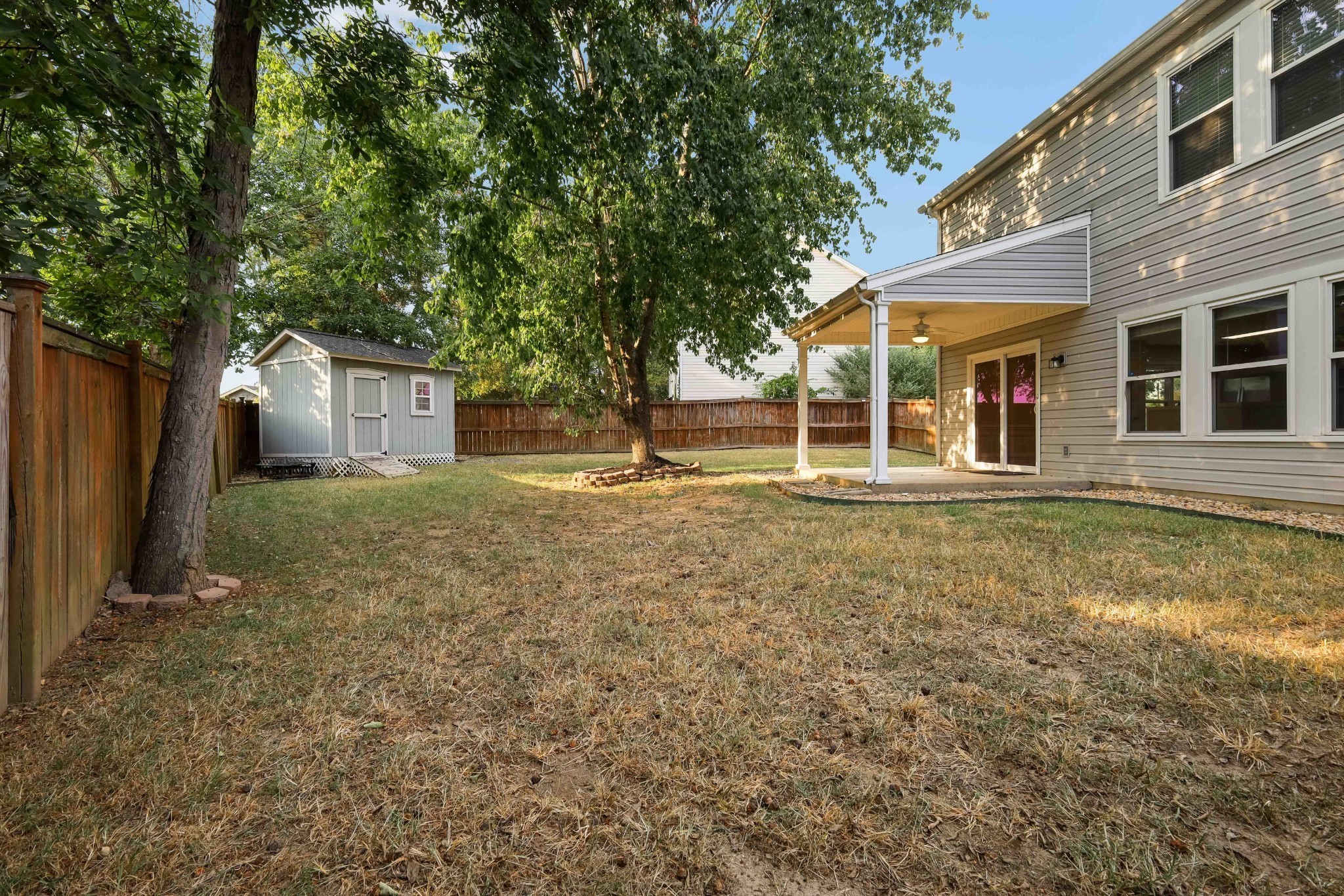 2201 Cardiff Lane Mount Juliet, TN 37122 - Photo 8 of 47 a backyard of a house with oven and large tree