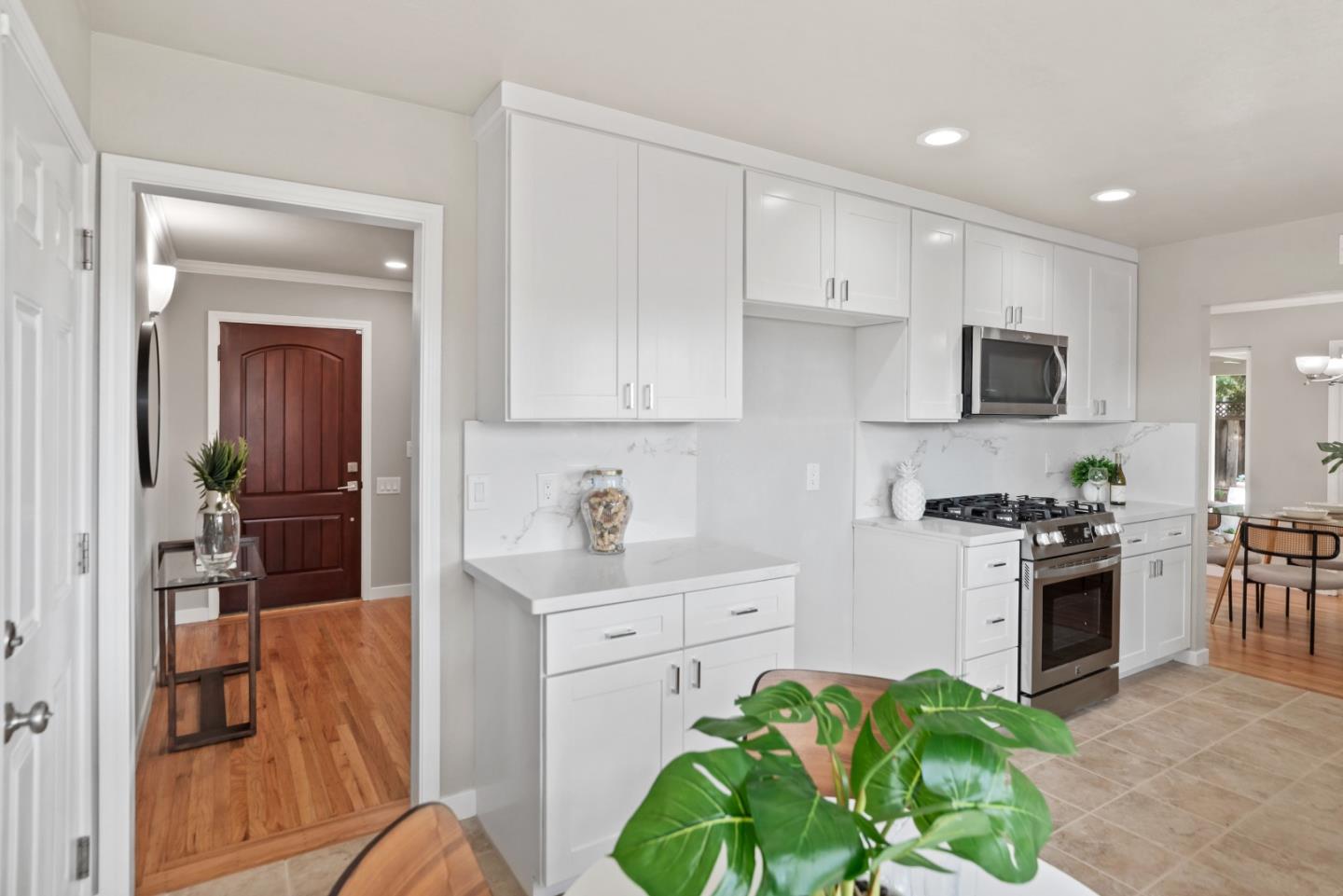 1001 Valley Forge Drive Sunnyvale, CA 94087 - Photo 11 of 24 a kitchen with stainless steel appliances granite countertop a stove a sink and a refrigerator