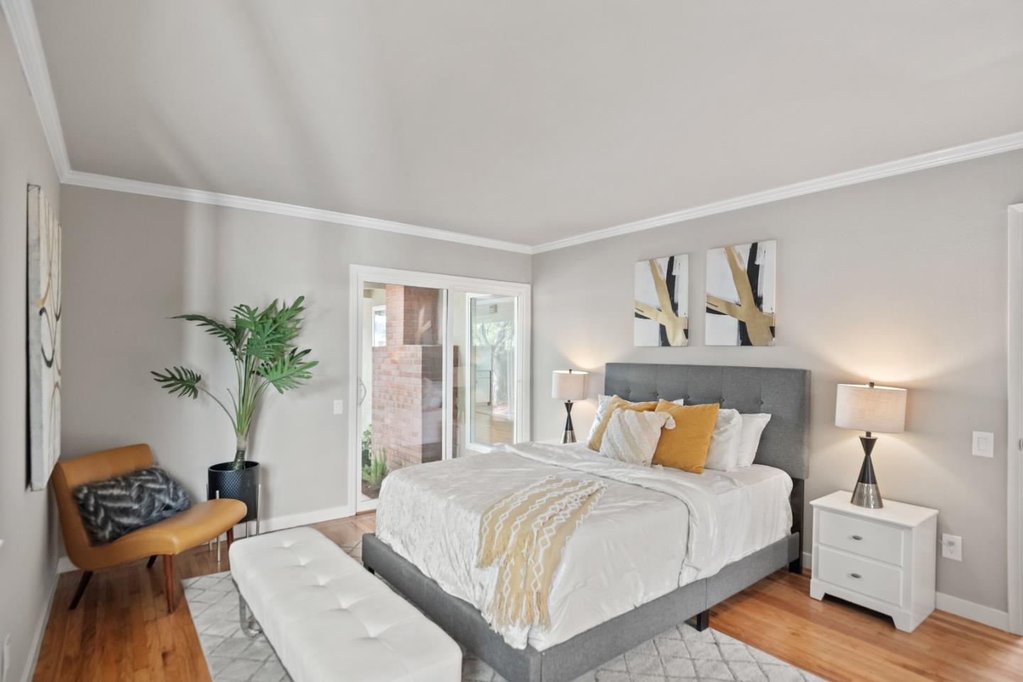 1001 Valley Forge Drive Sunnyvale, CA 94087 - Photo 16 of 24 a bedroom with a bed and wooden floor