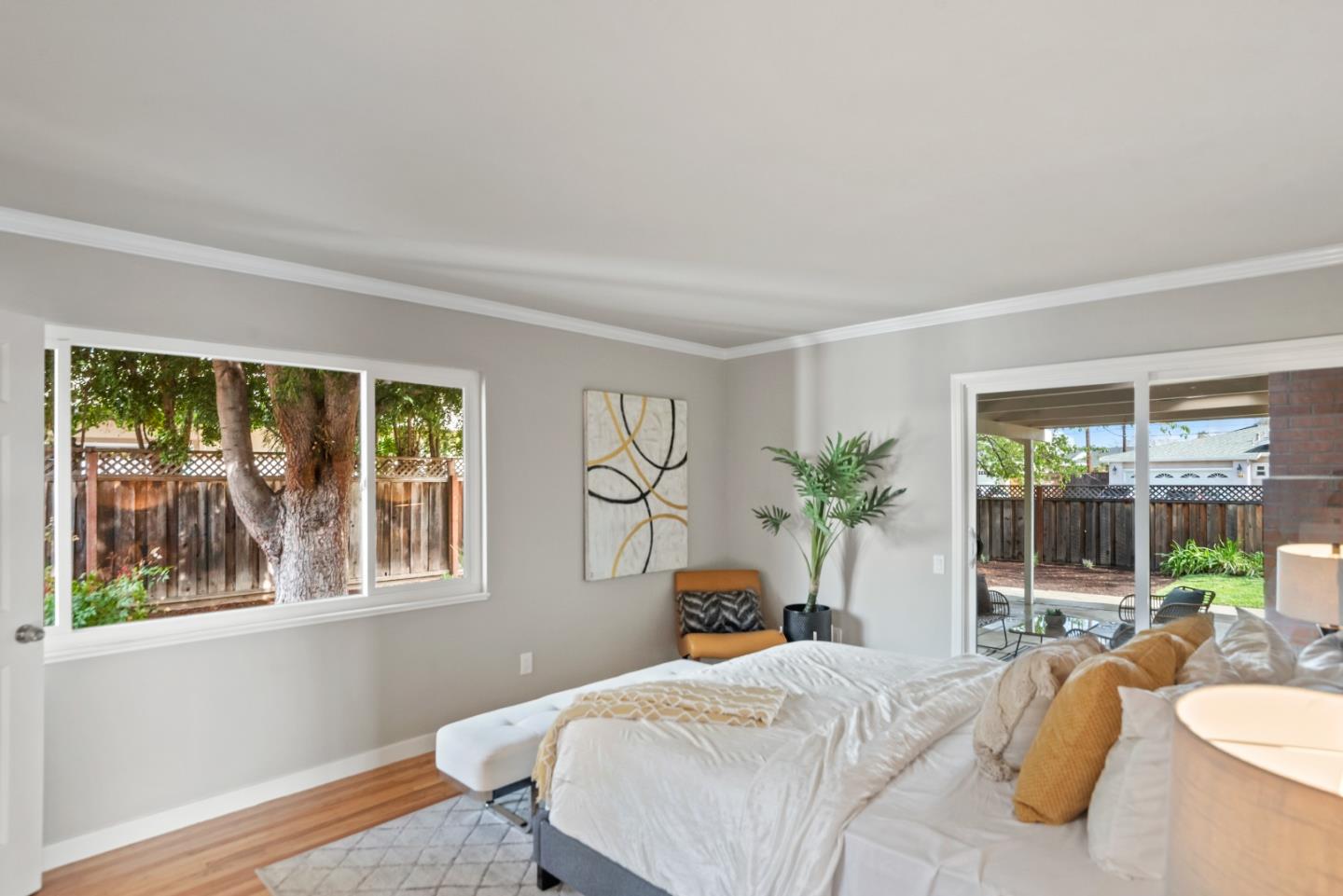1001 Valley Forge Drive Sunnyvale, CA 94087 - Photo 17 of 24 a bedroom with a large bed and a large window