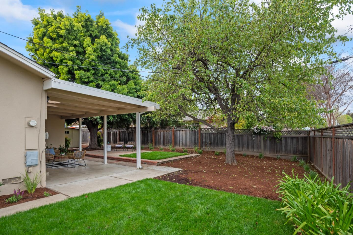 1001 Valley Forge Drive Sunnyvale, CA 94087 - Photo 23 of 24 a view of a chair and table in backyard of the house