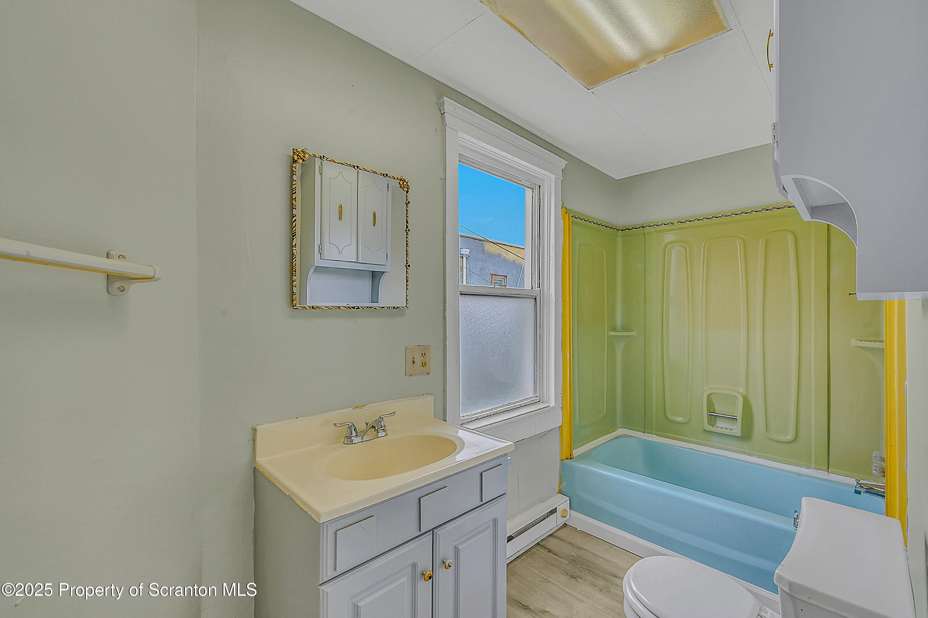 627 Main Street Duryea, PA 18642 - Photo 14 of 26 a bathroom with a sink toilet and shower