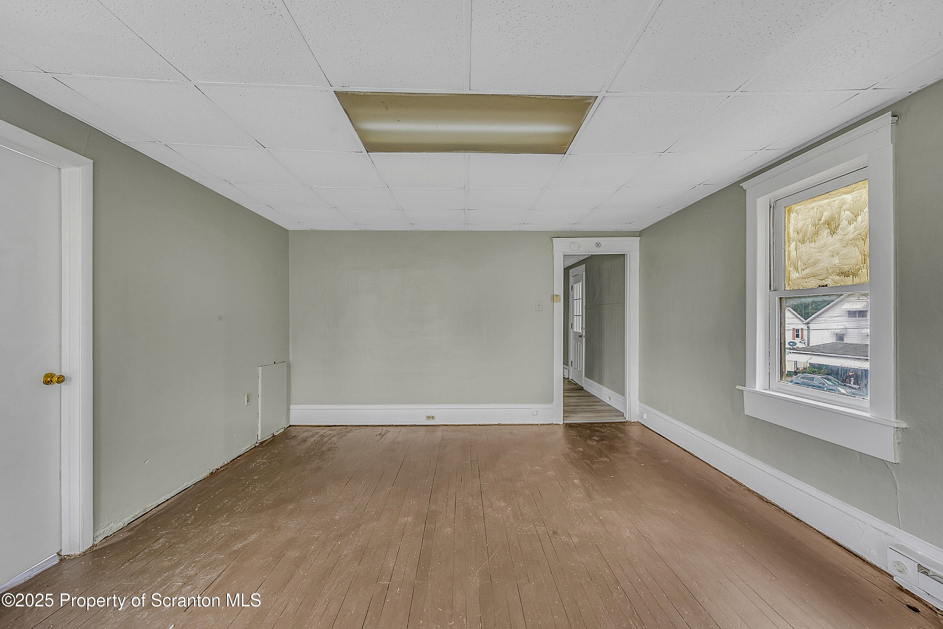 627 Main Street Duryea, PA 18642 - Photo 17 of 26 a view of an empty room with a window