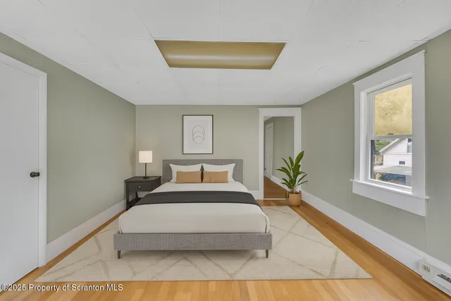 a spacious bedroom with a large bed and a window