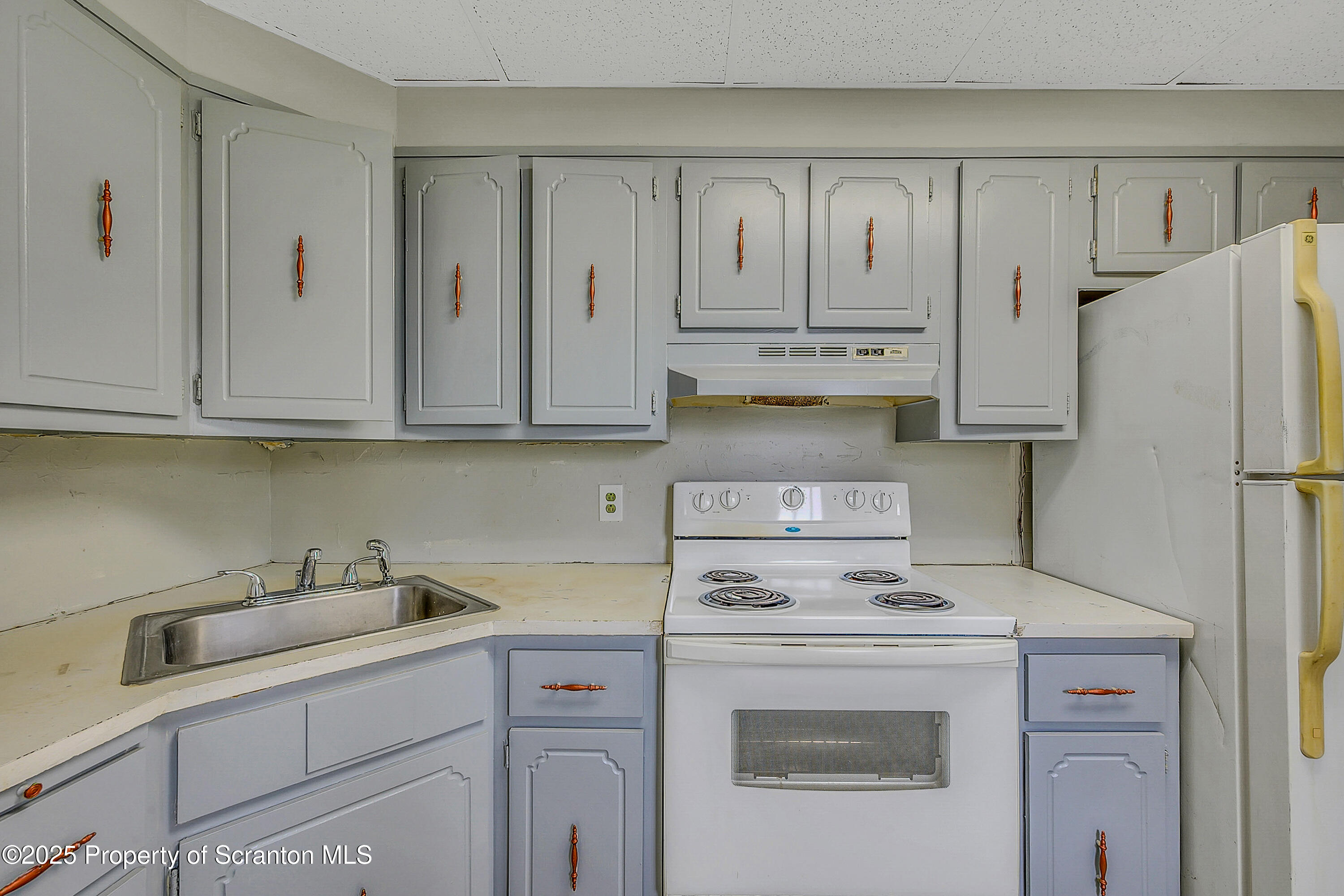 627 Main Street Duryea, PA 18642 - Photo 25 of 26 a kitchen with appliances a sink and cabinets