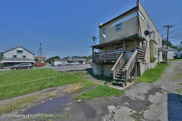 a view of a house with a park