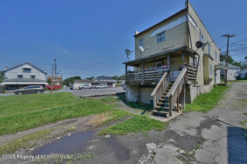 627 Main Street Duryea, PA 18642 - Photo 4 of 26 a view of a house with a park