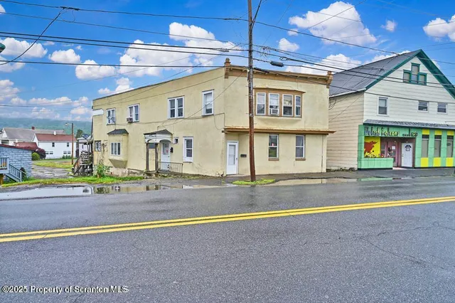 a view of a building with a swimming pool