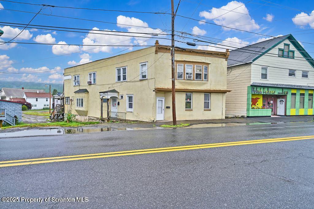 627 Main Street Duryea, PA 18642 - Photo 5 of 26 a view of a building with a swimming pool