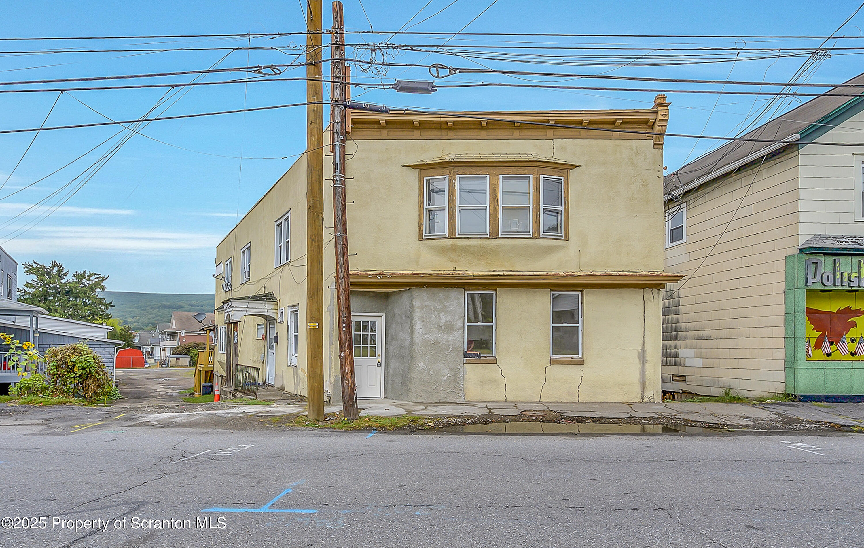 627 Main Street Duryea, PA 18642 - Photo 7 of 26 a front view of a house with a road