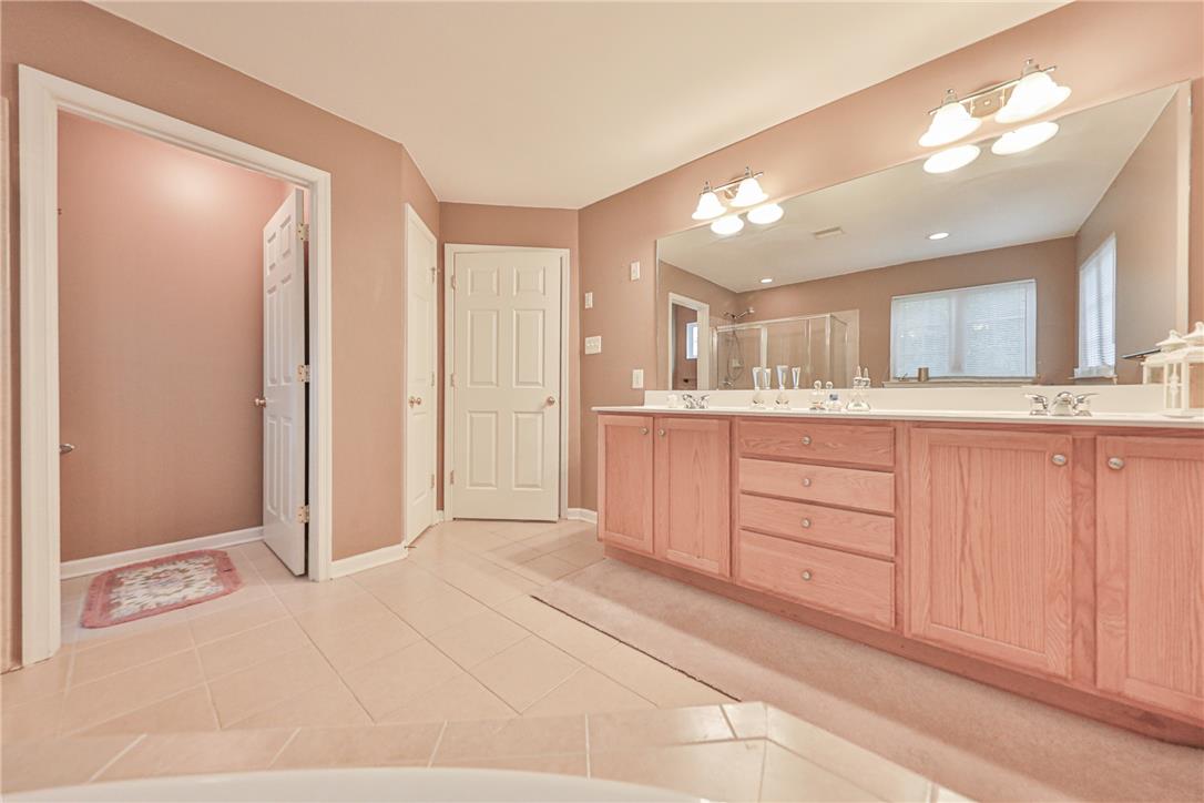 138 Clover Hollow Road Easton, PA 18045 - Photo 48 of 95 Dual vanities with ample storage enhance this spacious bathroom's utility and flow.