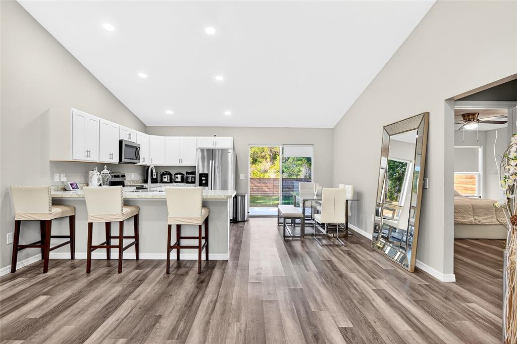 14862 Southwest 79 Terrace Road Dunnellon, FL 34432 - Photo 11 of 28 a living room with lots of furniture and wooden floor