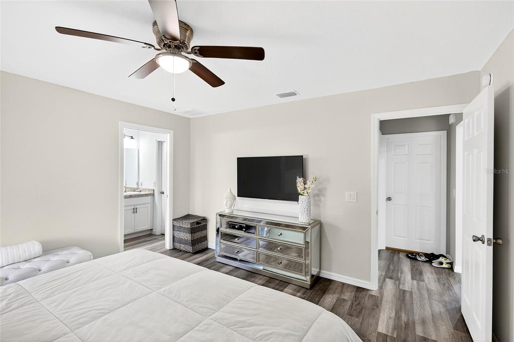 14862 Southwest 79 Terrace Road Dunnellon, FL 34432 - Photo 12 of 28 a bedroom with a bed and a flat screen tv