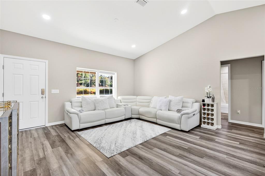 14862 Southwest 79 Terrace Road Dunnellon, FL 34432 - Photo 17 of 28 a living room with furniture and a wooden floor