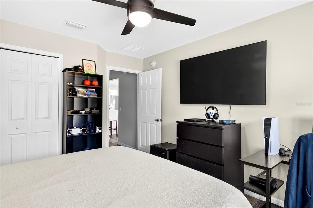 14862 Southwest 79 Terrace Road Dunnellon, FL 34432 - Photo 19 of 28 a bedroom with a bed and a flat screen tv