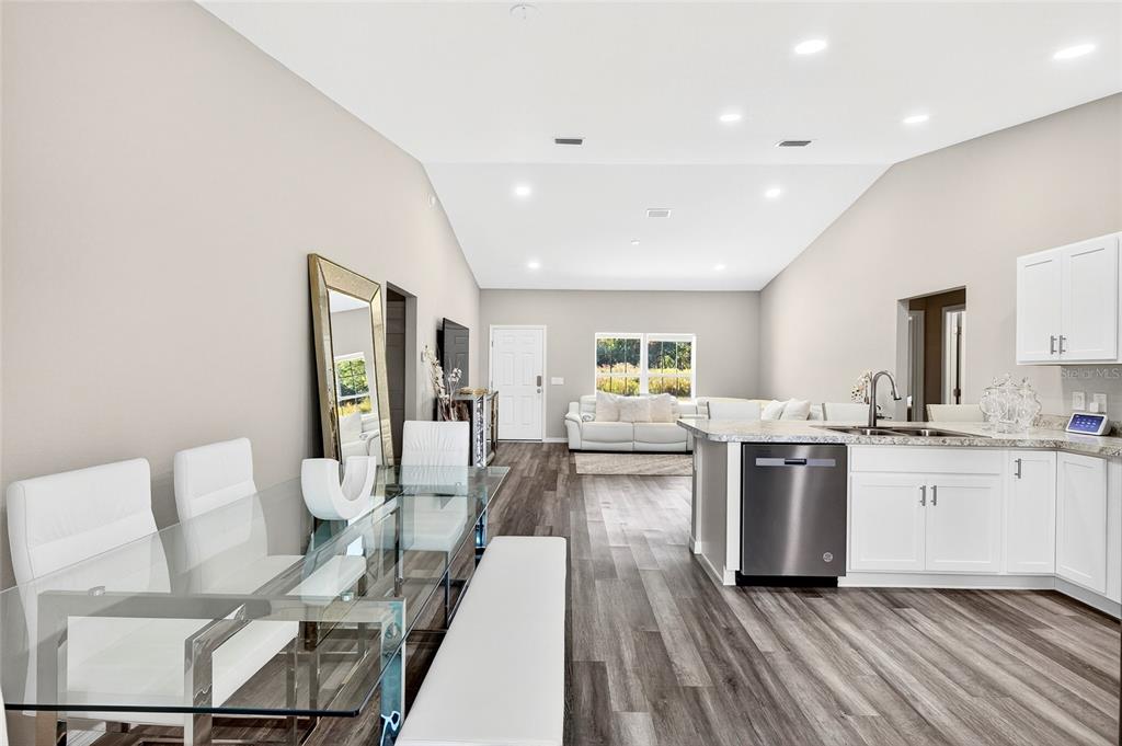 14862 Southwest 79 Terrace Road Dunnellon, FL 34432 - Photo 23 of 28 a living room with furniture appliances and wooden floor